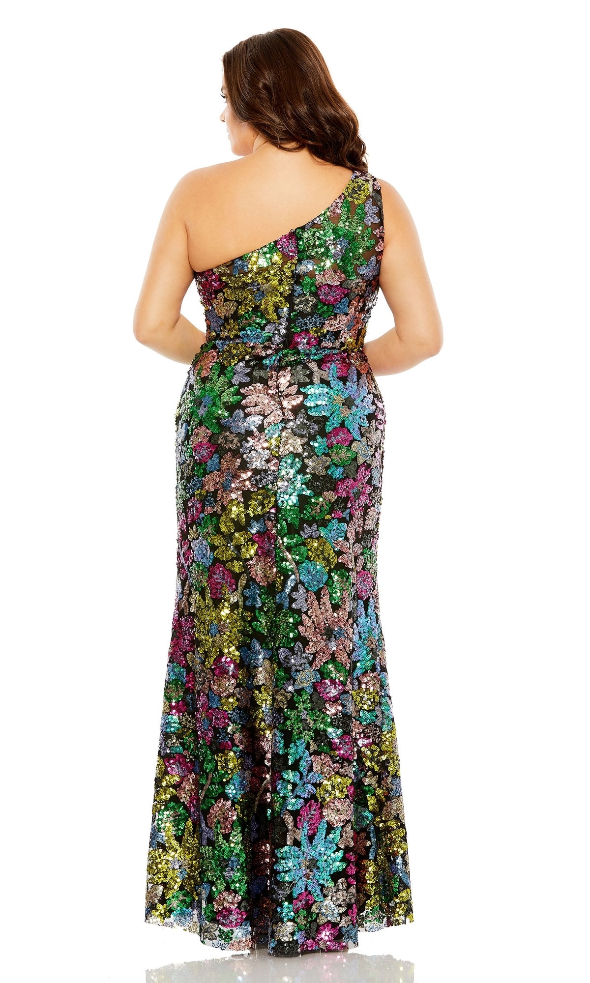 A woman faces away, wearing the Long Plus-Size Formal Dress 68545 by Mac Duggal—a one-shoulder, floor-length black sequin gown with a vibrant floral pattern, perfect for any special occasion.